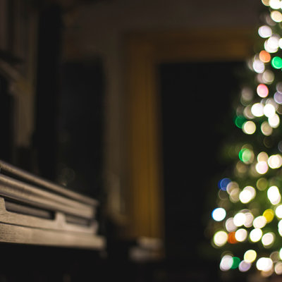 Piano lite by Christmas Tree on Christmas Eve - Photo by Steve Halama