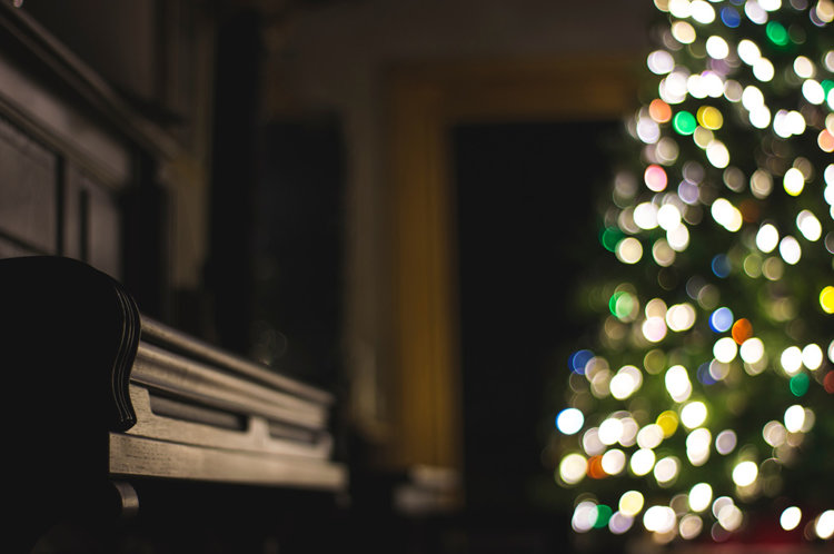 Piano lite by Christmas Tree on Christmas Eve - Photo by Steve Halama